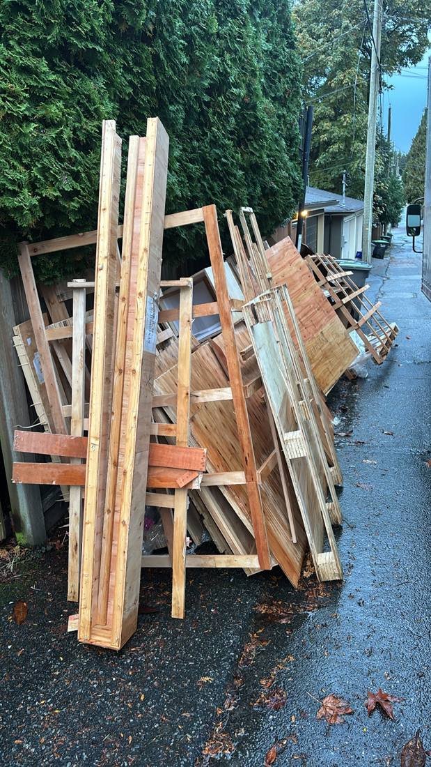 Crates and lumber, back-lane pickup